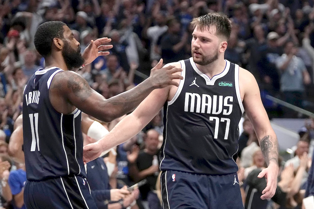 Dallas Mavericks’ Kyrie Irving and Luka Doncic, right, celebrate the team’s win in Game 3 of an NBA basketball second-round playoff series against the Oklahoma City Thunder Saturday in Dallas. (AP)