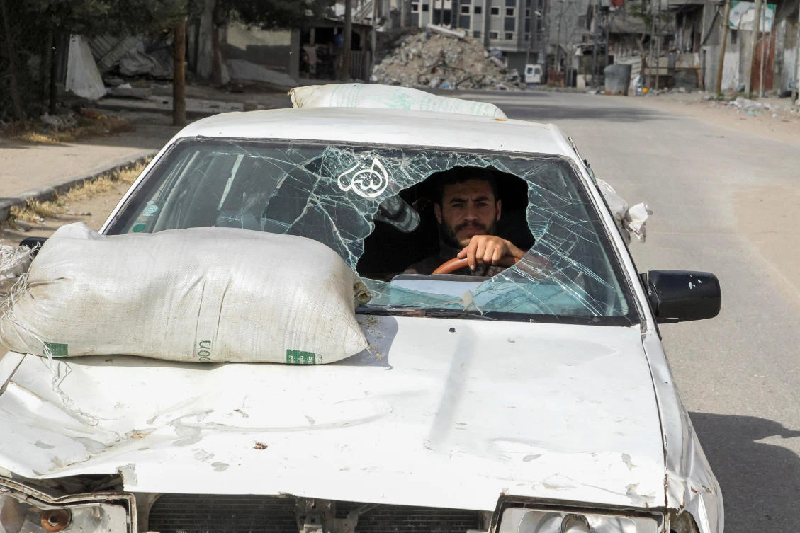A displaced Palestinian man drives a car damaged during Israel's military offensive as he flees Rafah, in the southern Gaza Strip May 12, 2024. (Reuters)