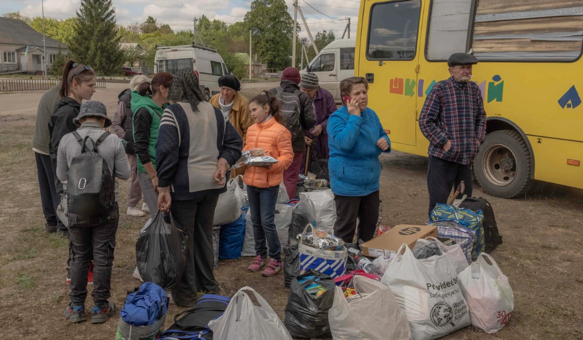 Evacuees from the town of Vovchansk arrive at an evacuation point in Kharkiv region, on Sunday as Russian forces renew a ground offensive. (AFP)
