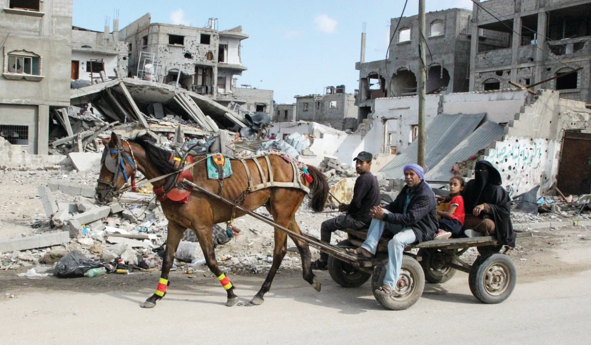 Displaced Palestinians flee Rafah on Sunday after Israeli forces launched a ground and air offensive in the eastern part of the southern Gaza city. (Reuters)