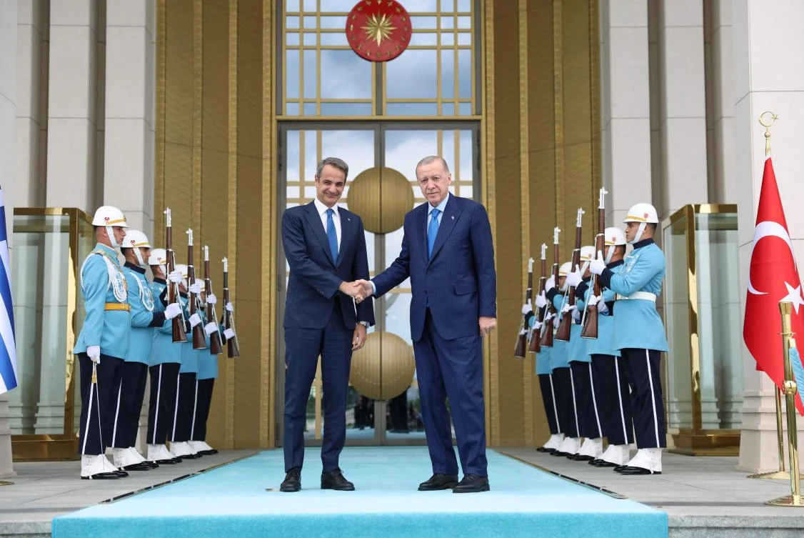Greek Prime Minister Kyriakos Mitsotakis (L) and Turkish President Recep Tayyip Erdogan pose before a meeting in Ankara. (AFP)