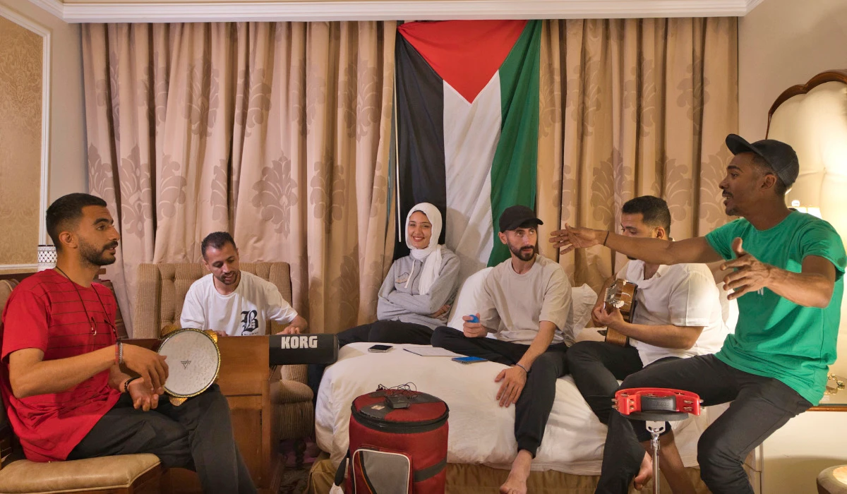 From left, Fares Anbar, Abood Qassim, Rahaf Shamaly, Hamada Nasrallah, Ahmed Haddad and Said Fadel of the Gaza Strip-based Sol Band prepare for a practice session in Doha, Qatar, Friday, May, 3, 2024. (AP)
