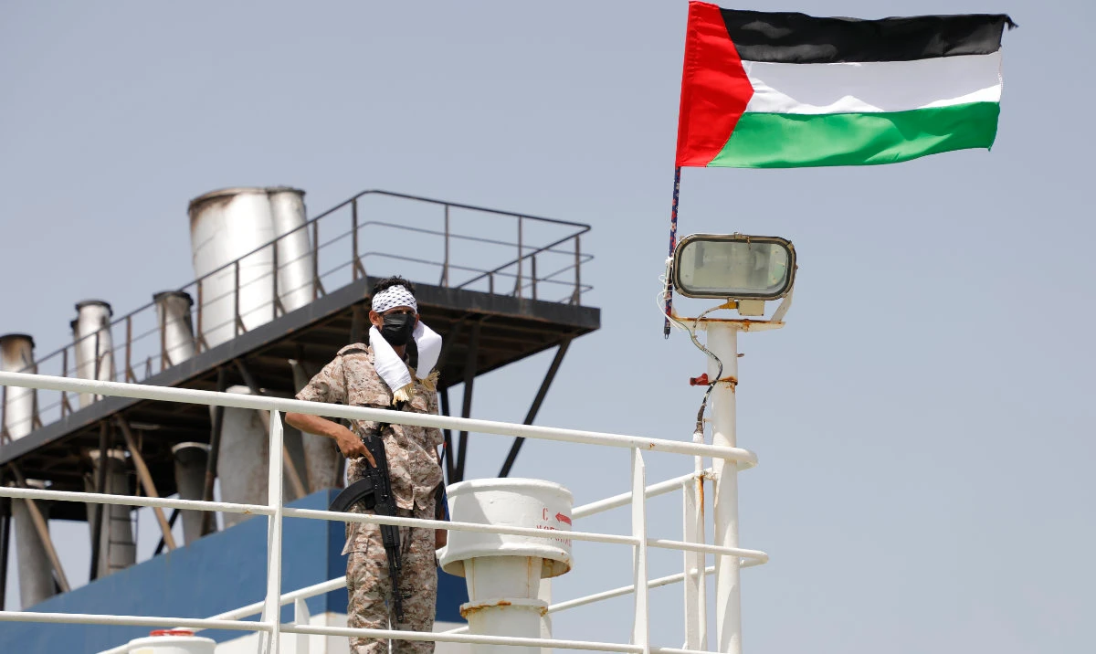 A Houthi soldier stands on board of the Israeli Galaxy ship which was seized by the Houthis, in the port of Saleef, near Hodeidah, Yemen, Sunday, May 12, 2024. (AP)