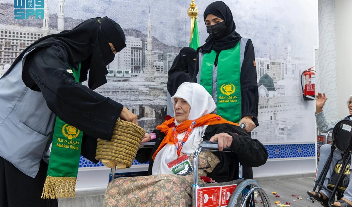 Officials of Makkah Route Initiative receive a pilgrim ahead of annnual Hajj pilgrimage in Saudi Arabia on May 14, 2024. (SPA)
