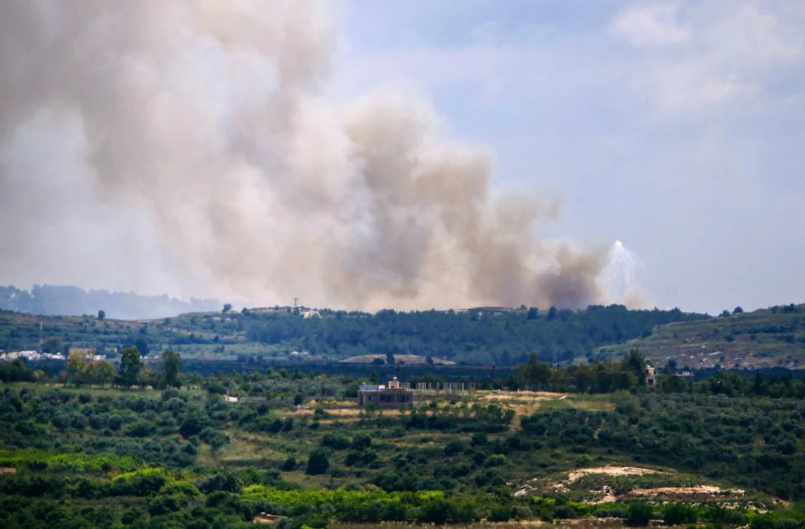 Smoke billows over the Lebanese village of Alma Al-Shaab on May 14, 2024, in southern Lebanon near the border with Israel. (AFP)