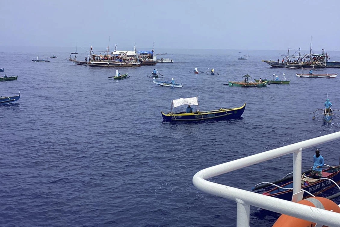 Fishing boats carrying activists and volunteers pass by waters off Palauig Point, Zambales province, northwestern Philippines as they head toward Scarborough Shoal May 15, 2024. (Philippine Coast Guard via AP)