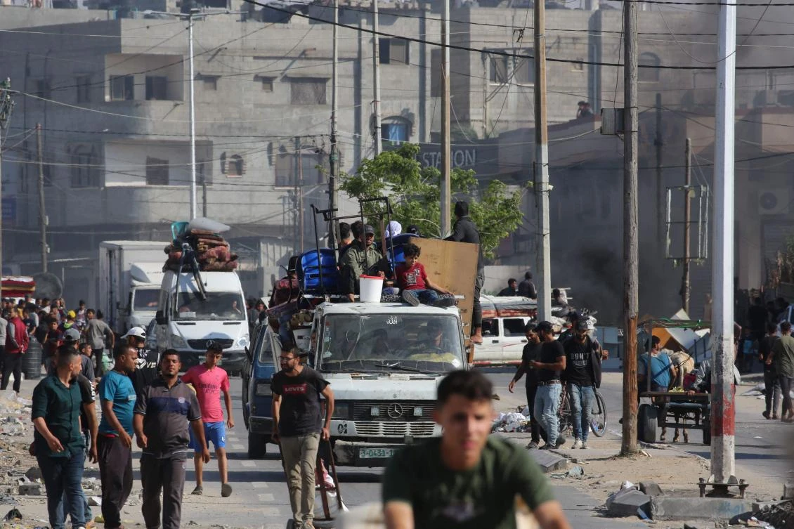 Retired Indian army officer Waibhav Anil Kale was killed and a colleague was injured in an unidentified strike on a UN car in Rafah. Above, Palestinians flee Rafah toward a safer area on May 12, 2024. (AFP)