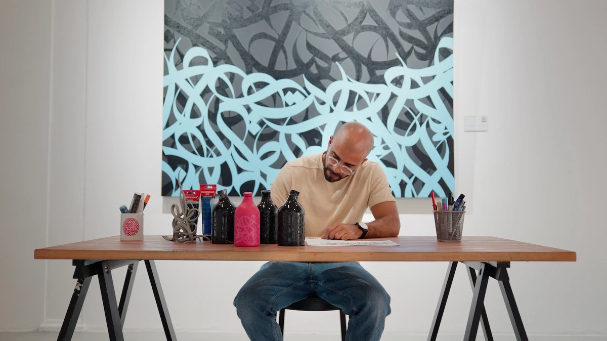 The project is called “Tacapae” and consists of olive oil-filled bottles decorated with El Seed’s swirling calligraphy. (Supplied)