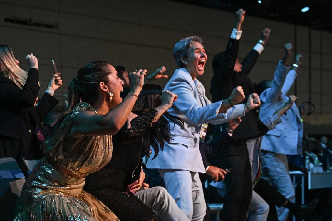 Members of the Brazilian delegation celebrate after Brazil wins its bid to host the 2027 Women's World Cup during the 74th FIFA Congress in Bangkok. (AFP)