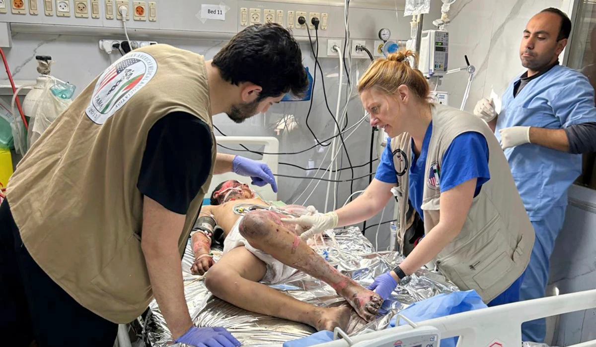 Monica Johnston RN, Burn and wound care nurse from Portland Oregon with the PAMA Palestinian American Medical Association, monitors a patient who sustained major burns on May 8, 2024, Khan Younis, Gaza. (AP)