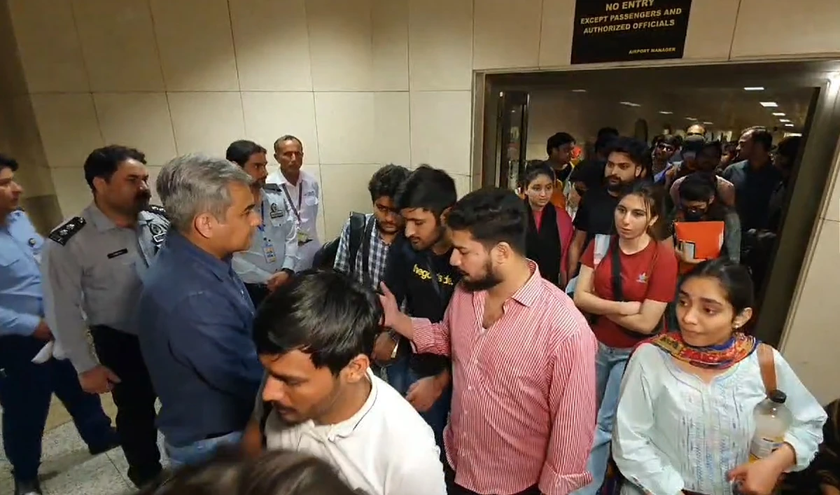Pakistan’s Interior Minister Mohsin Naqvi welcomes Pakistani students returning from Bishkek, Kyrgyzstan at the Lahore Airport on May 18, 2024. (Interior Ministry)