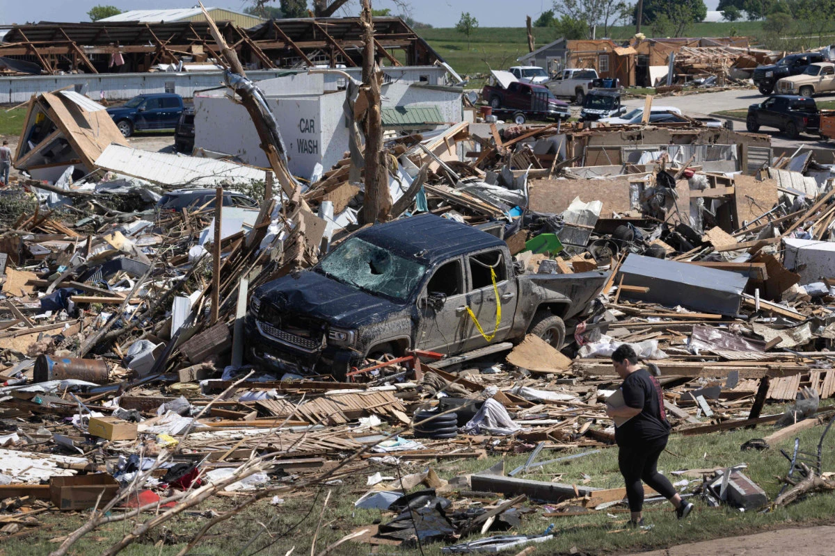 Residents and first responders go through the damage after a tornado tore through town yesterday afternoon on May 22, 2024 in Greenfield, Iowa. (Getty Images/AFP)