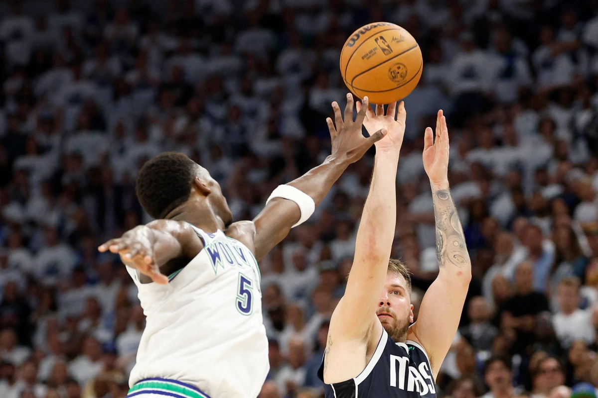 Luka Doncic of the Dallas Mavericks shoots the ball against Anthony Edwards of the Minnesota Timberwolves during the fourth quarter in Game 1 of the Western Conference Finals at Target Center on May 22, 2024 in Minneapolis, Minnesota. (GETTY IMAGES NORTH AMERICA /AFP)