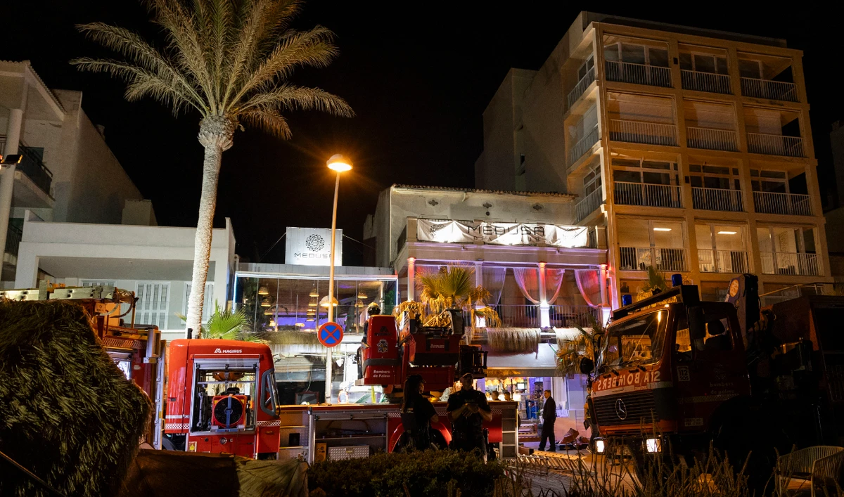 Emergency vehicles are seen after a two-story restaurant collapsed, killing four and injuring at least 17 people on Playa de Palma, south of the Spanish Mediterranean island's capital Palma de Mallorca, on May 23, 2024. (AFP)