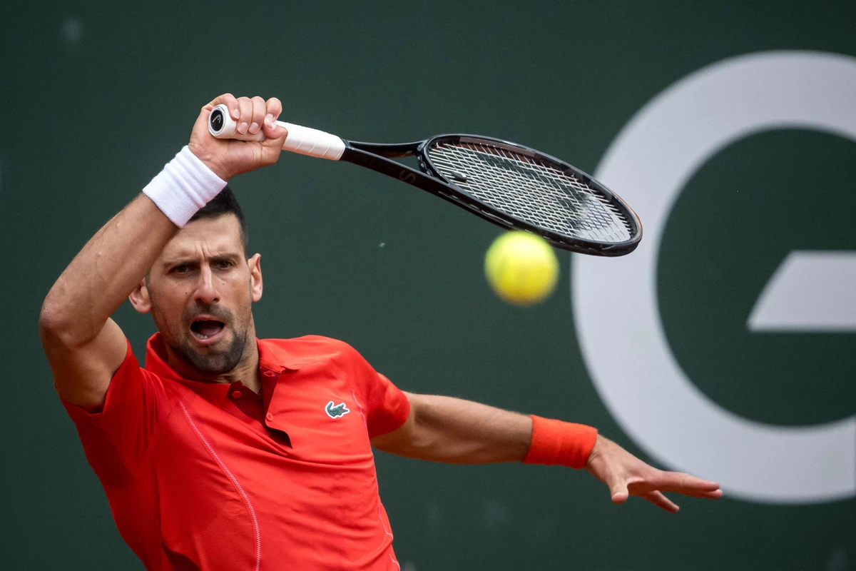 Serbia's Novak Djokovic plays a forehand return to Netherlands' Tallon Griekspoor during their ATP 250 Geneva Open tennis tournament single quarter final match, in Geneva on May 23, 2024. (AFP)