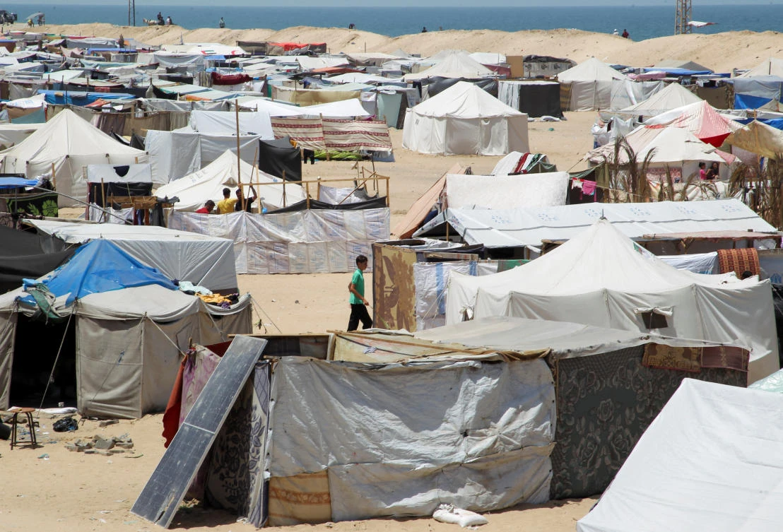 Displaced Palestinians, who fled their house due to Israeli strikes, shelter at a tent camp in the Al-Mawasi area in Rafah on May 22, 2024. (Reuters)