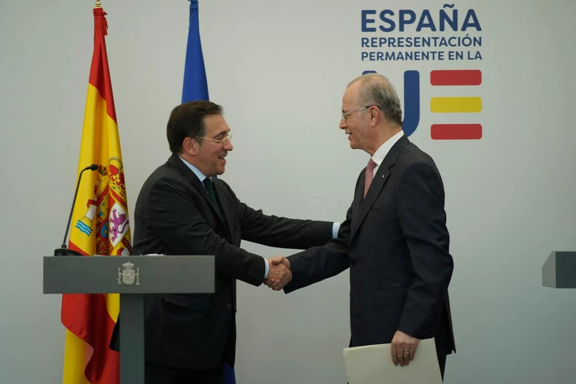 Spanish Minister for Foreign Affairs, European Union and Cooperation, Jose Manuel Albares (L) shakes hands with Palestinian Prime Minister Mohammad Mustafa (R) during their meeting at the the Permanent Representation of Spain to the European Union in Brussels, on May 26, 2024. (AFP)