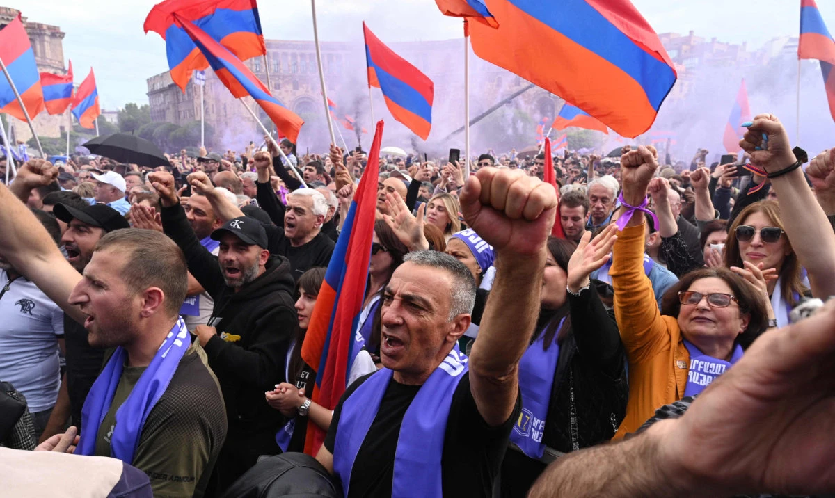 Armenians rally to demand Prime Minister Nikol Pashinyan's resignation over land transfer to neighbouring Azerbaijan, at the central Republic Square in Yerevan on May 26, 2024. (AFP)