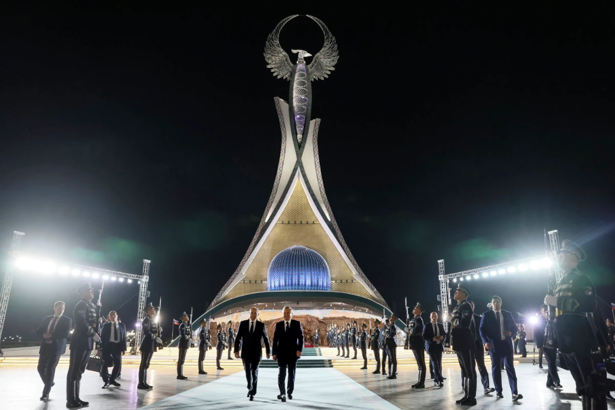 Russian President Vladimir Putin, left, and Uzbek President Shavkat Mirziyoyev visit Yangi O'zbekiston park during their meeting in Tashkent on May 26, 2024. (Sputnik, Kremlin Pool Photo via AP)