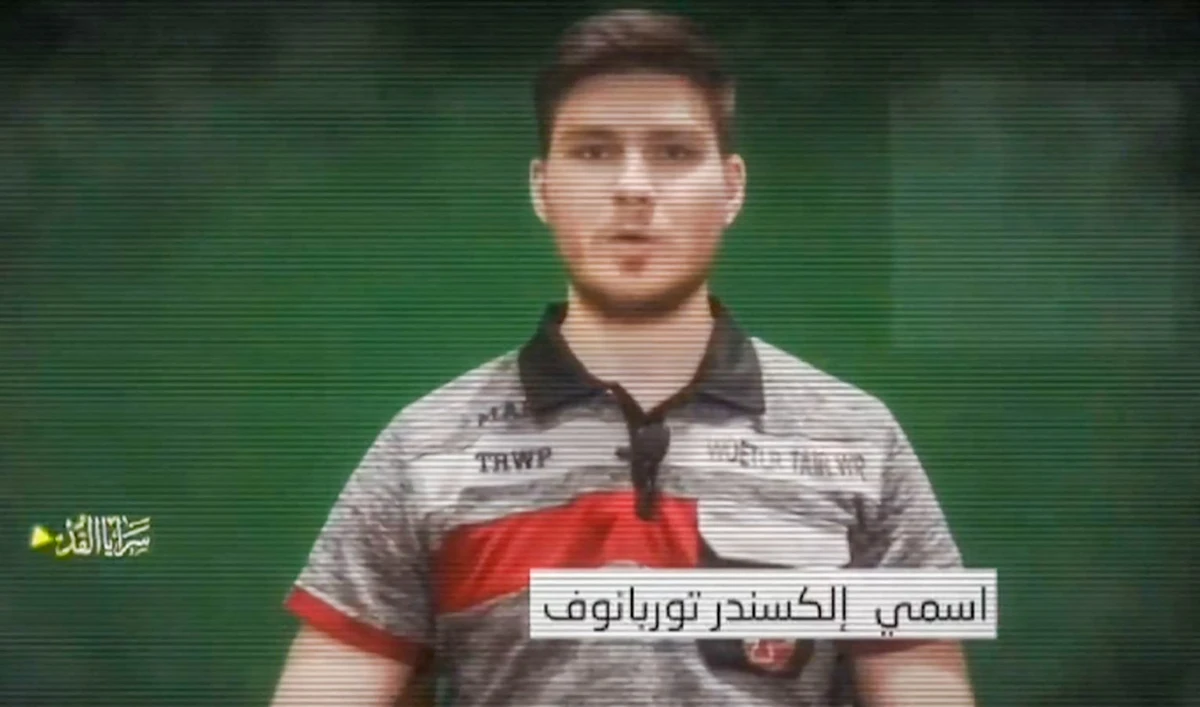 An image grab from a video released by the Palestinian militant group Islamic Jihad on May 28, 2024, shows an Israeli hostage held in Gaza, identified by Israeli media as 28-year-old Russian-Israeli hostage Sasha Trupanov, speaking to the camera. (AFP)