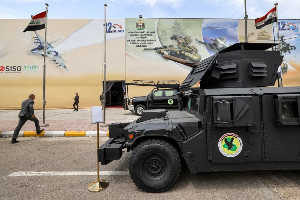 A man walks past an armed humvee vehicle of the Iraqi counter-terrorism service (CTS) (AFP)