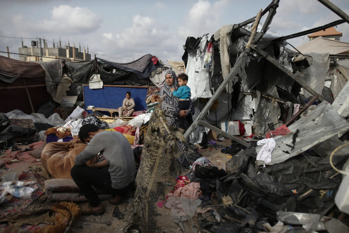 Displaced Palestinians inspect their tents destroyed by Israel's bombardment in Rafah on May 28, 2024. (AP)