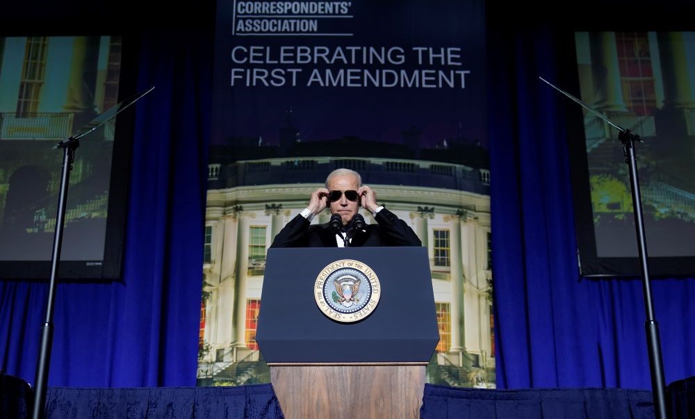 Joe Biden puts on sunglasses during the White House Correspondents’ dinner at the Washington Hilton, Apr. 29, 2023. (AP Photo)