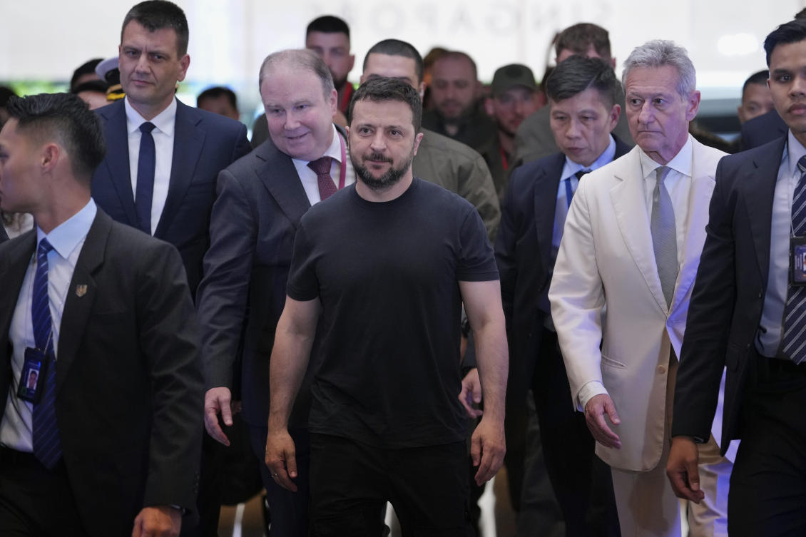 Ukraine’s President Volodymyr Zelensky, center, arrives at a hotel, the venue of the 21st Shangri-La Dialogue summit in Singapore on June 1, 2024. (AP)