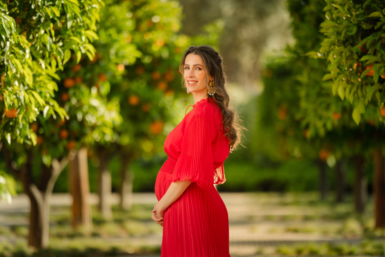 In the photos, the princess, who is from Saudi Arabia, donned the Vernia red blouson sleeve pleated maxi dress by Alice + Olivia, a contemporary clothing brand based in New York City. (Supplied)