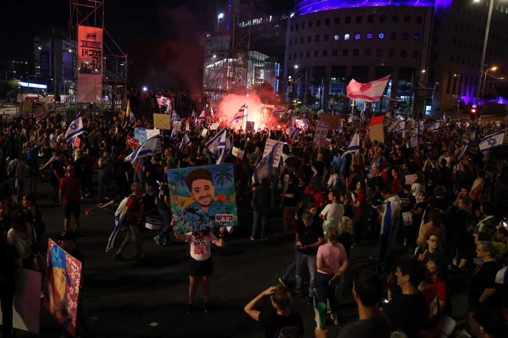 Relatives and supporters of Israelis held hostage by Palestinian Hamas militants in Gaza since the October 7 attacks, demonstrate to call for their release in Tel Aviv on June 1, 2024. (AFP)