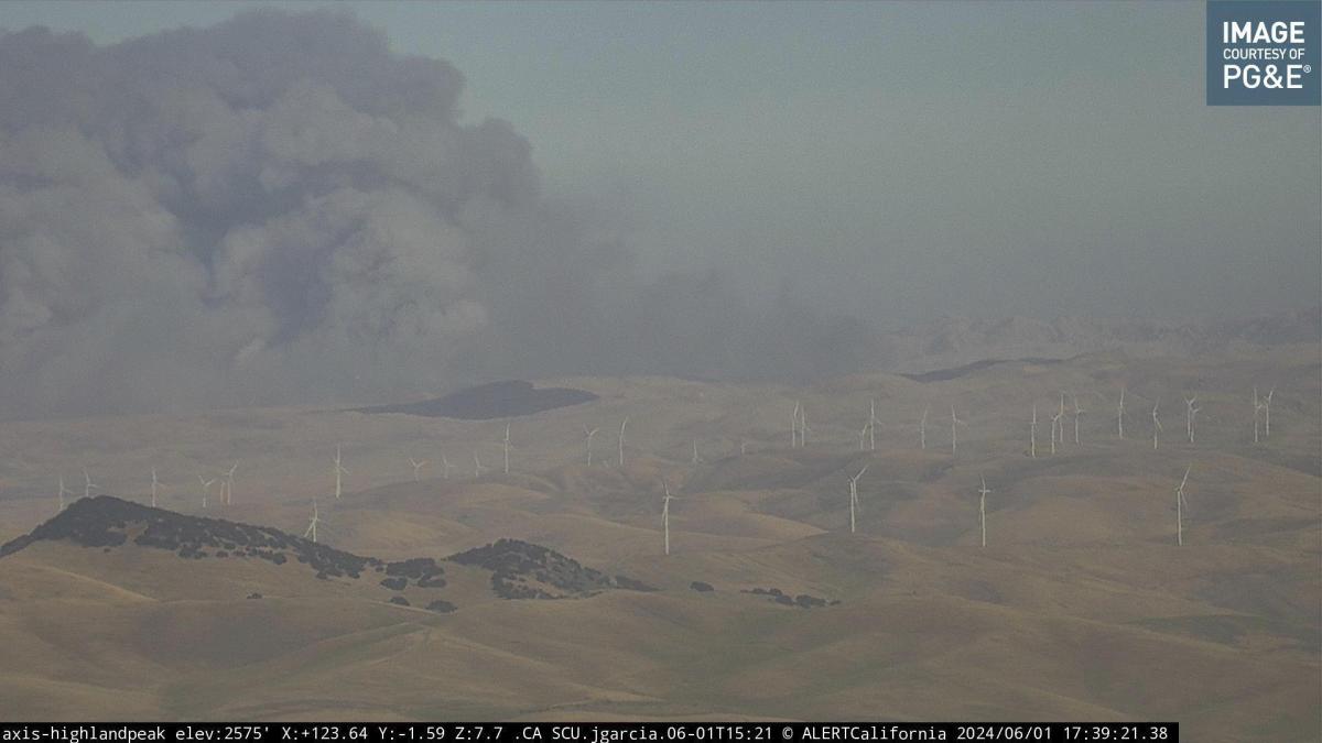 Above, an AlertCalifornia/UC San Diego monitoring camera image shows smoke rising from the Corral Fire near the city of Tracy, California on June 1, 2024. (AlertCalifornia/UC San Diego via AP)