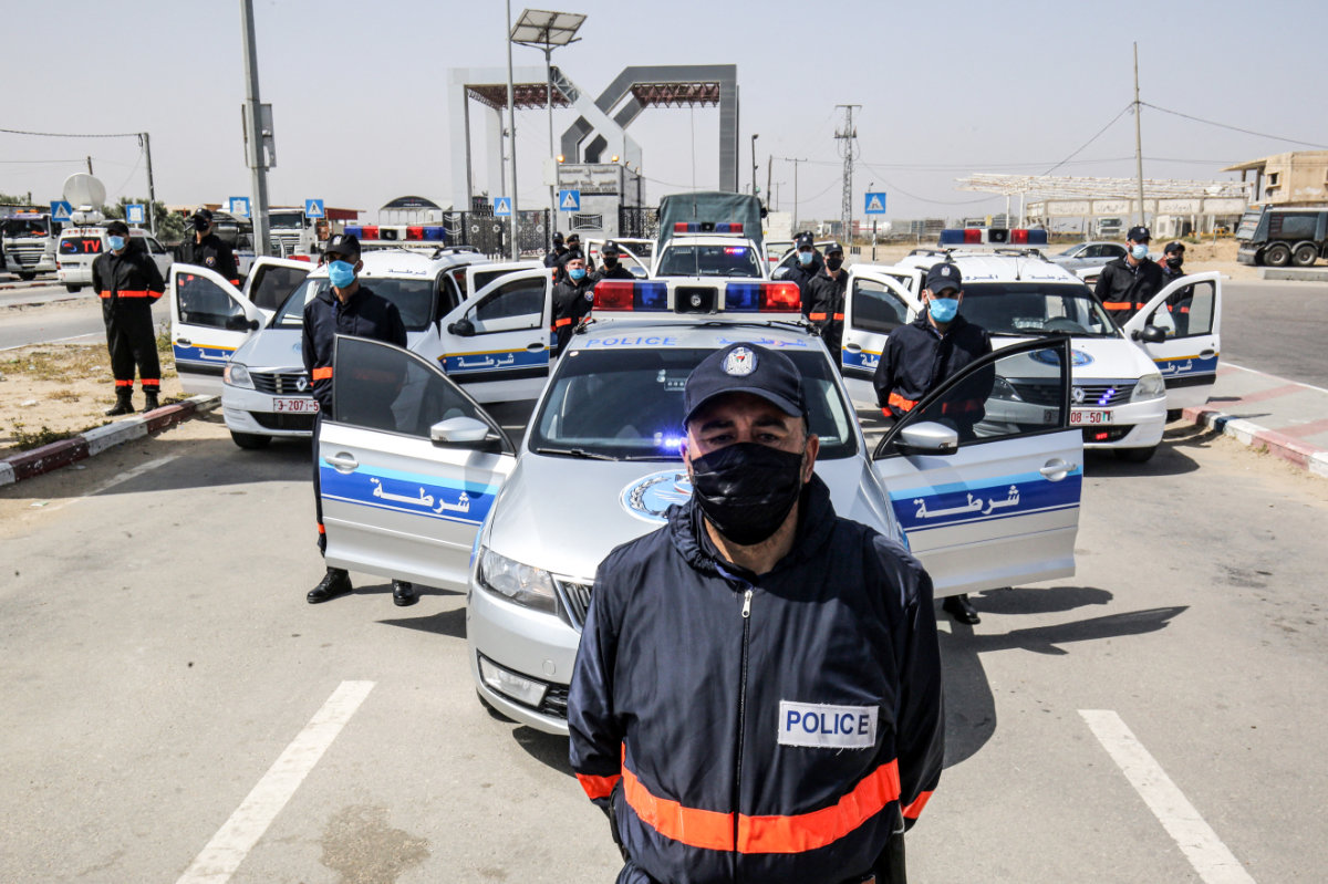 In this photo taken on May 12, 2020, Hamas security officers regulate entry at the Rafah border crossing with Egypt in the southern Gaza Strip amid the COVID-19 coronavirus pandemic. Israel seeks replace the deeply entrenched Hamas with an alternative local governing body for Gaza. (AFP)