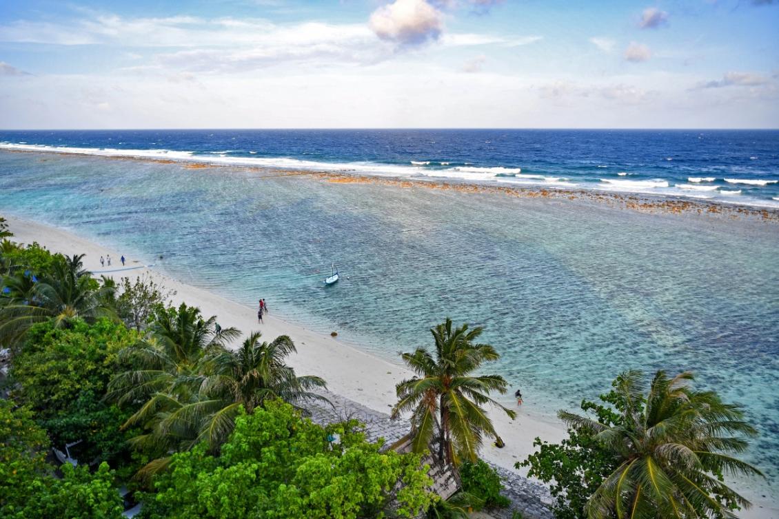A general view shows people at a beach in Hulhumale on December 26, 2023.(AFP)