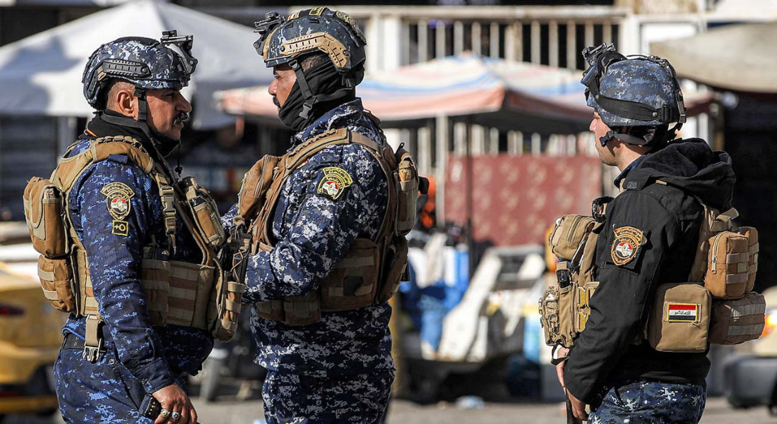 Iraqi security forces are stationed by the Freedom Monument in Baghdad's Tahrir Square. (AFP/File)