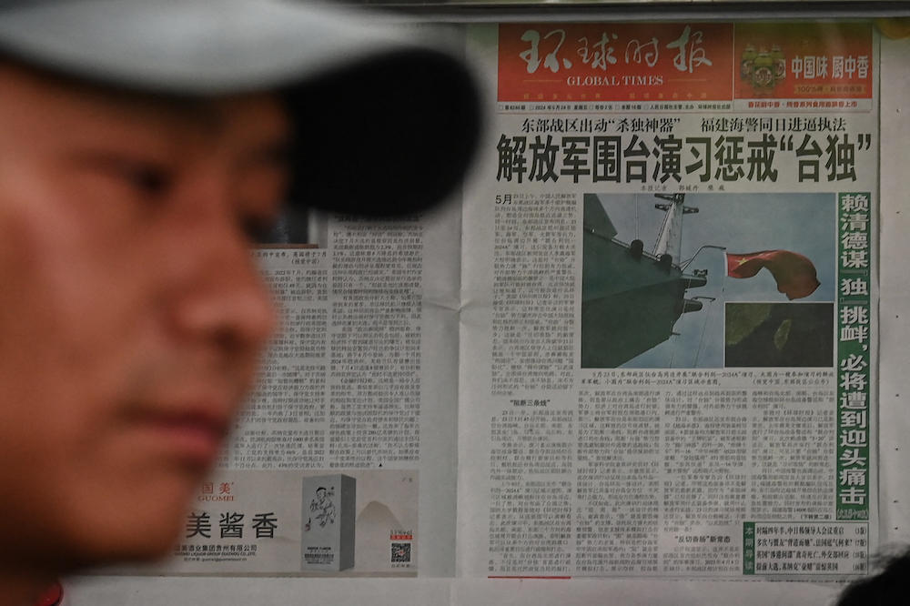 Tensions have ramped up since the May 20 inauguration of Taiwan’s new President Lai Ching-te. Above, a Chinese newspaper front page shows news coverage of China’s military drills around Taiwan, in Beijing on May 24, 2024. ( AFP)
