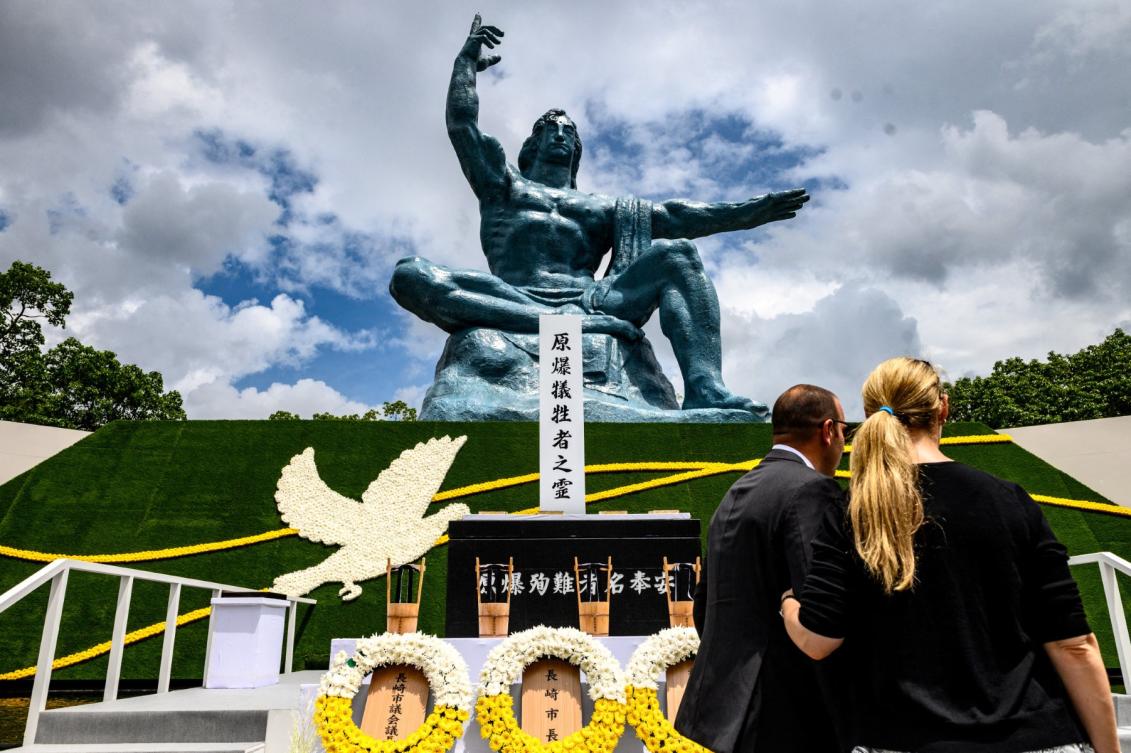 People stand in front of the cenotaph and the Peace statue after the ceremony marking the 75th anniversary of the atomic bombing of Nagasaki, at the Nagasaki Peace Park on August 9, 2020. (File/AFP)
