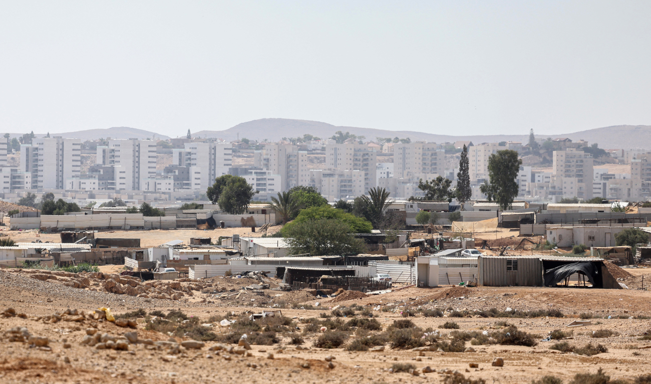 A picture shows the unrecognized Bedouin village of Ras Jrabah, east of Dimona city (background) in southern Israel, on May 29, 2024. (AFP)