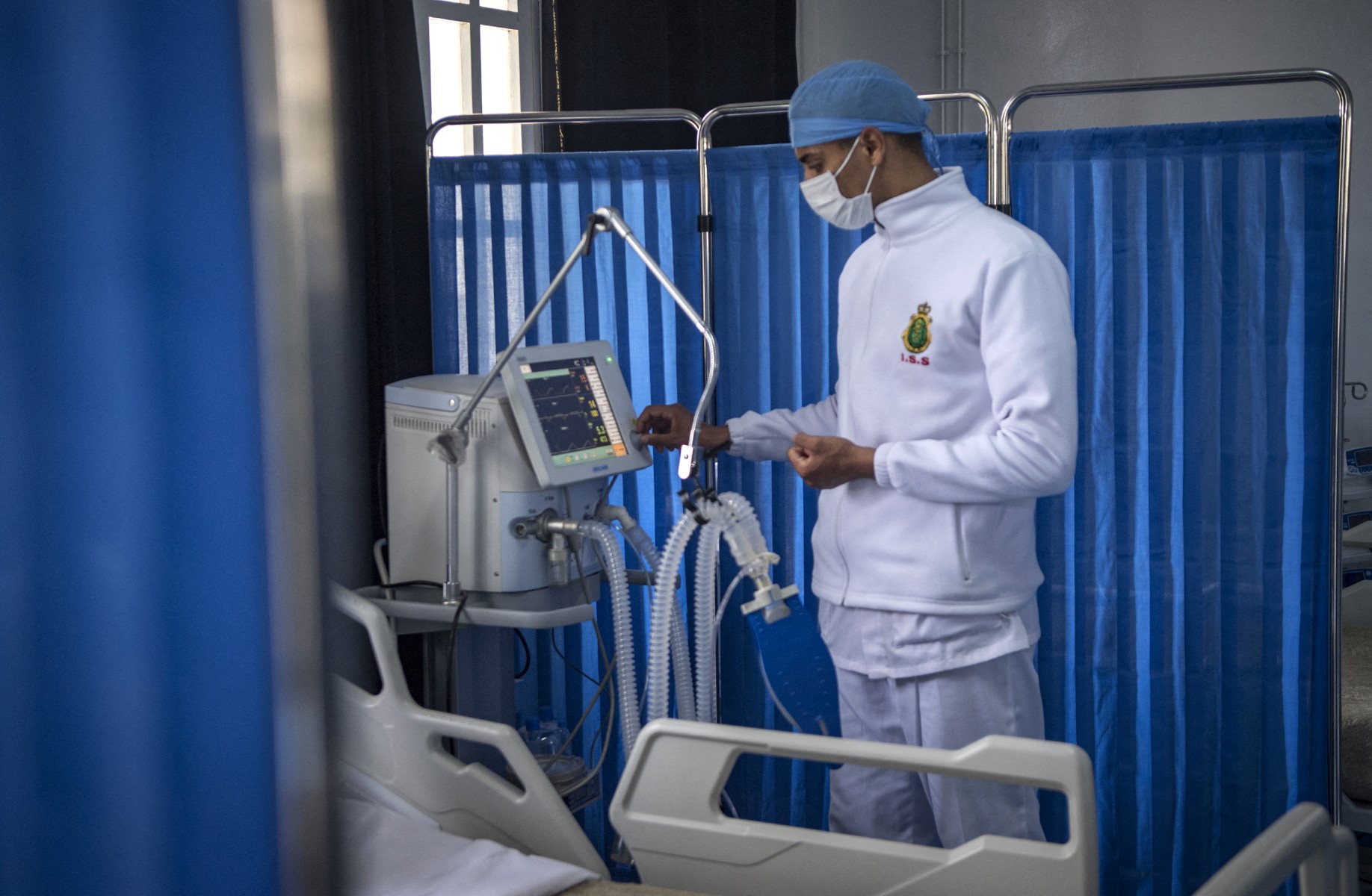 A member of the medical staff at Moroccos's military field hospital in Nouaceur, South of Casablanca, checks a monitor on April 18, 2020. (AFP)