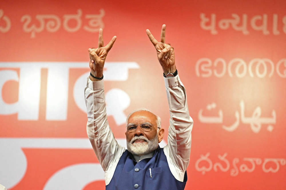Modi celebrates bittersweet victory as BJP loses absolute majority