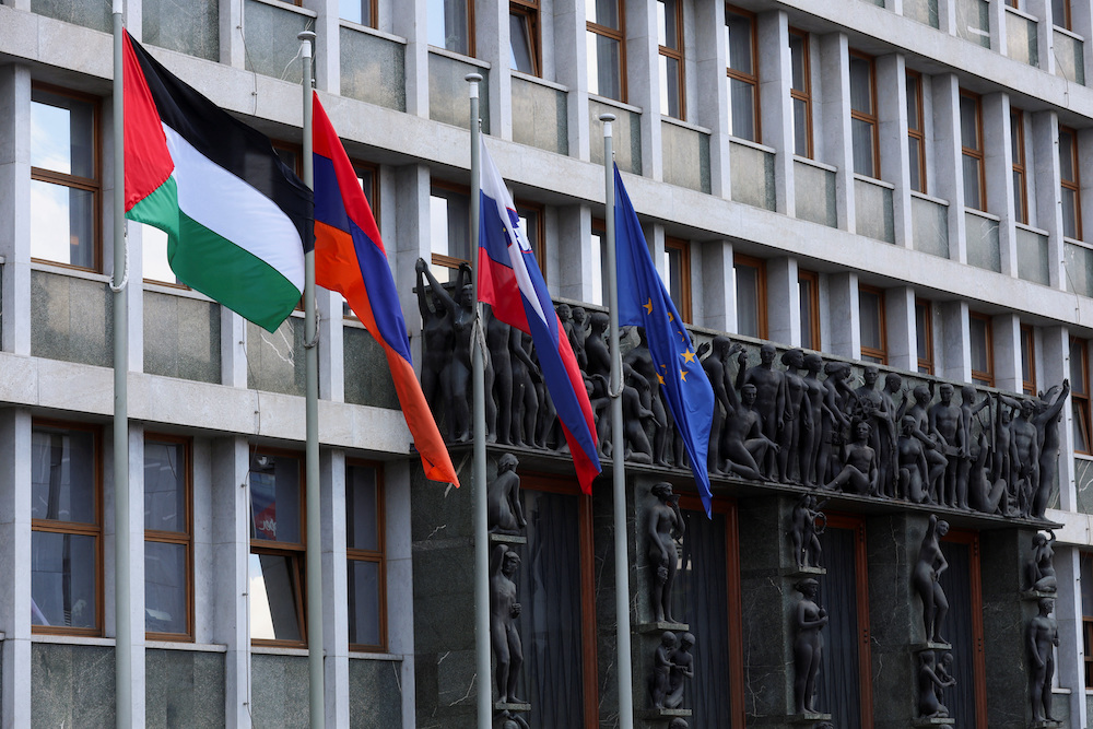 A Palestinian flag flutters among other flags in front of the Slovenian parliament after Slovenia recognized a Palestinian state, in Ljubljana, June 5, 2024. (Reuters)