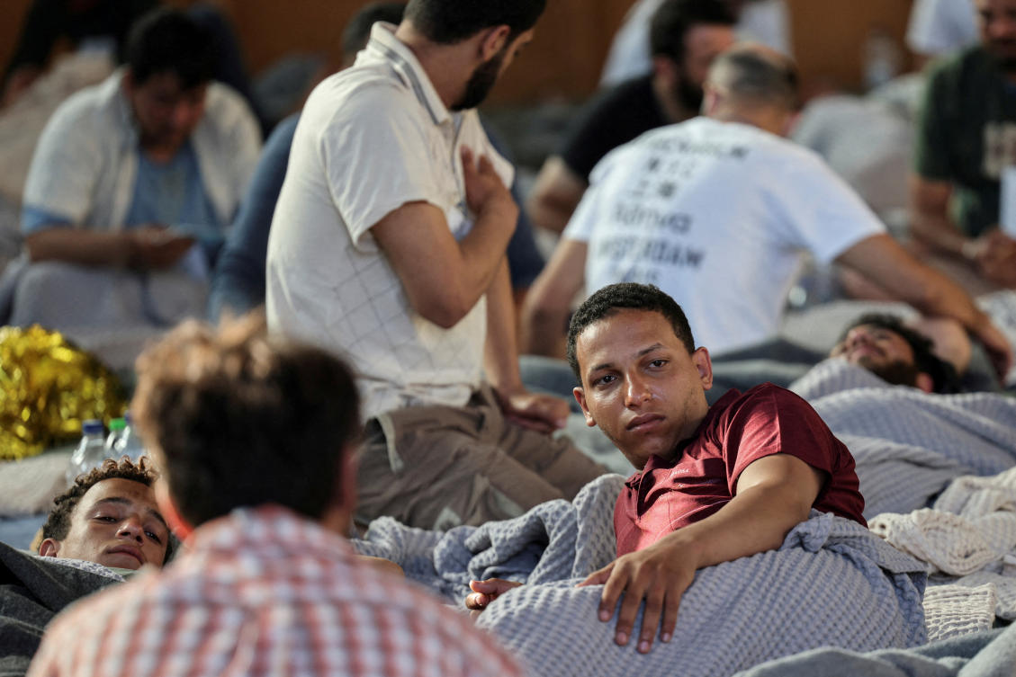 Egyptian survivor Mahmoud Shalabi, 22, one of the 104 survivors of a deadly migrant shipwreck off southwestern Greece, rests in a shelter following a rescue operation, in Kalamata, Greece, June 14, 2023. (REUTERS)