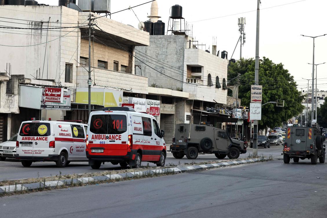 Palestinian ambulances are parked at the ready as clashes take place between Palestinian protesters and Israeli troops during a raid on the Balata refugee camp, in the Israeli occupied Palestinian West Bank. (File/AFP)