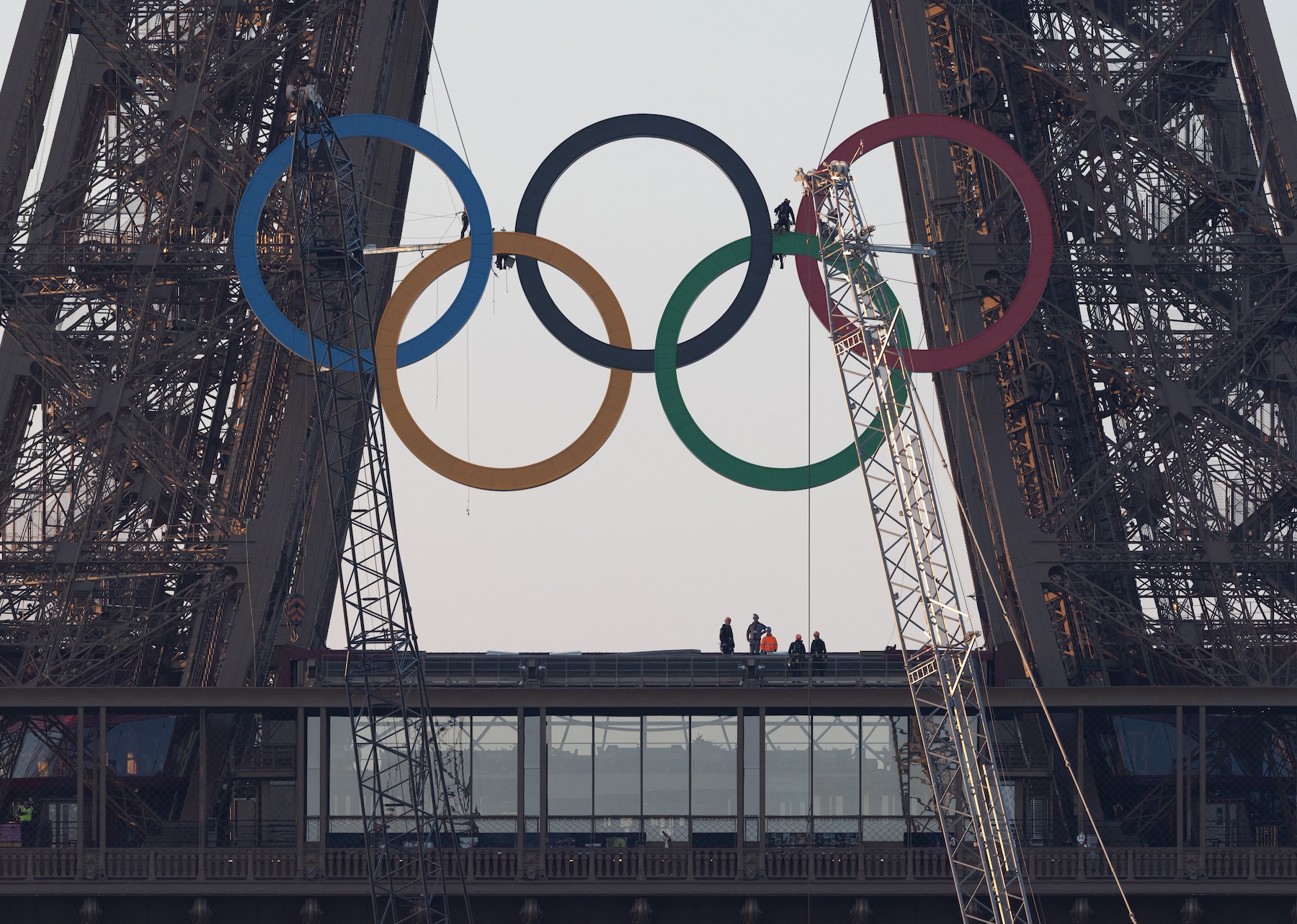 Paris Olympics organizers unveil a display of the five Olympic rings mounted on the Eiffel Tower