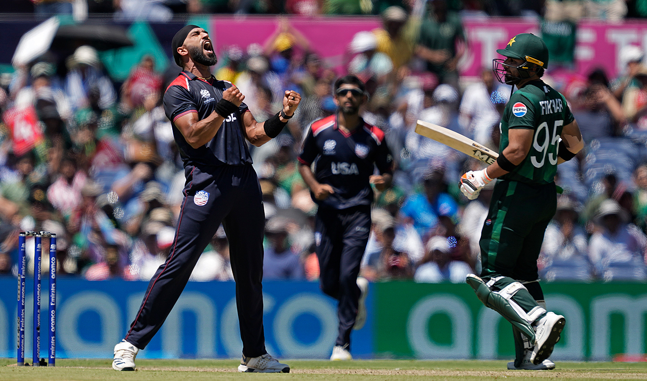 United States’ Jessy Singh, left, celebrates the dismissal of Pakistan’s captain Babar Azam during the ICC Men’s T20 World Cup cricket match between United States and Pakistan at the Grand Prairie Stadium in Grand Prairie, Texas on June 6, 2024. (AP)