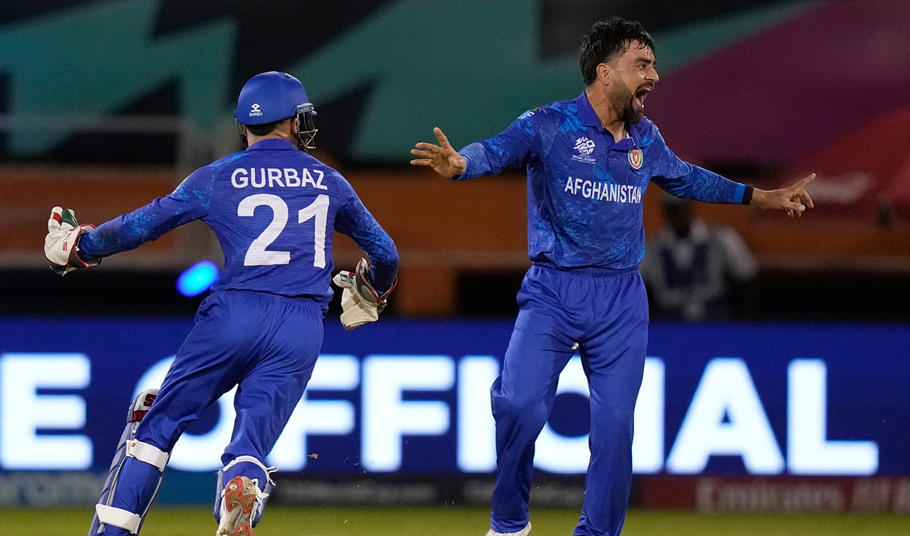 Afghanistan's captain Rashid Khan celebrates after he bowled New Zealand's Mark Chapman during an ICC Men's T20 World Cup cricket match at Guyana National Stadium in Providence, Guyana, Friday, June 7, 2024. (AFP)