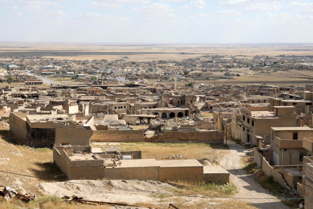 Buildings damaged during the 2014 attack by Islamic State (IS) fighters and the battles that followed, stand in the town of Sinjar in the northern Iraqi Nineveh province on May 6, 2024. (File/AFP)