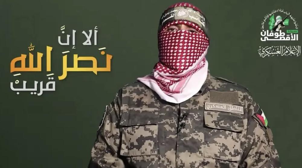 An image grab from a video released by Hamas in 2023 shows Abu Obeida — spokesman for Hamas’ military wing, the Ezzedine Al-Qassam Brigades — speaking with his face covered in a televised statement. (Screenshot via AFP)