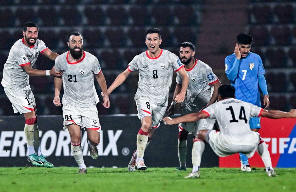 Afghanistan's Sharif Mukhammad (2L) celebrates with teammates after scoring a goal during the 2026 FIFA World Cup AFC qualifiers football match between India and Afghanistan at the Indira Gandhi Athletic Stadium in Guwahati on March 26, 2024. (AFP)