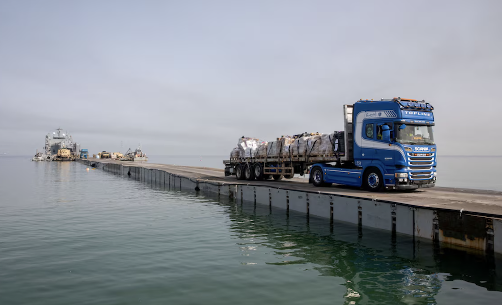 A truck carries humanitarian aid across Trident Pier, a temporary pier to deliver aid, off the Gaza Strip, amid the ongoing conflict between Israel and Hamas. (Reuters/File Photo)