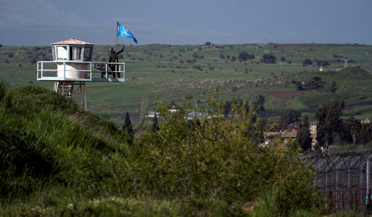 A UN peacekeeper guards at a post along the Israel-Syria border in the Israeli-occupied Golan Heights, April 2, 2024. (REUTERS)
